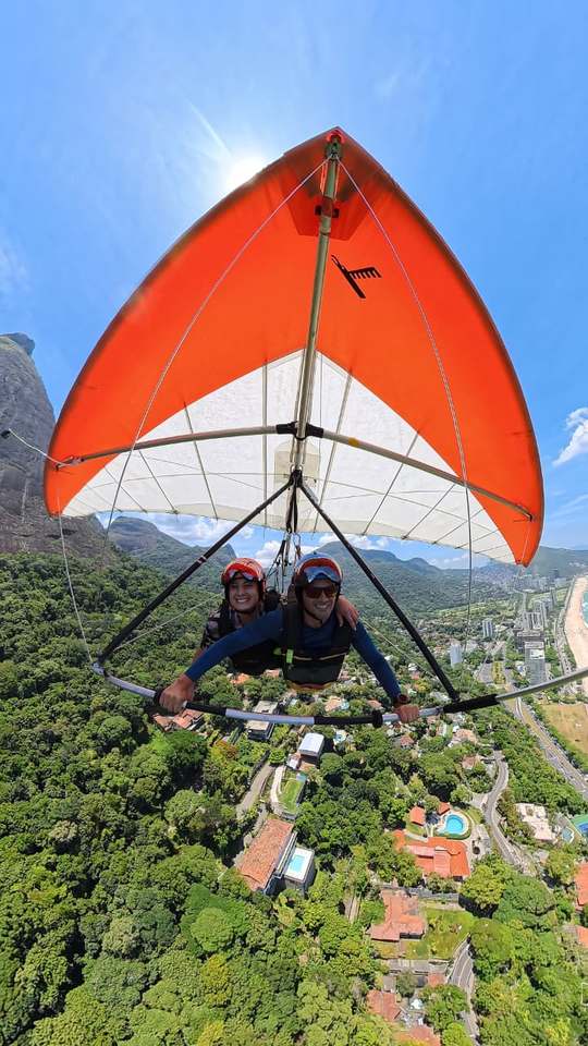 Tandem hang gliding flight with Pedra da Gávea in the background, Rio de Janeiro